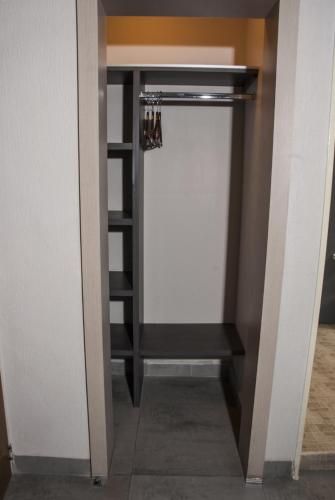a walk in pantry with a white closet at Hotel Expo Abastos in Guadalajara