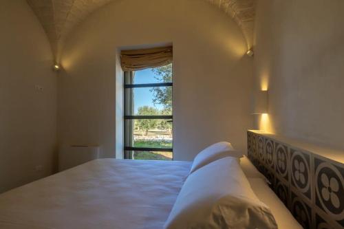 Ένα ή περισσότερα κρεβάτια σε δωμάτιο στο Luxury Villa Borgo Cinera