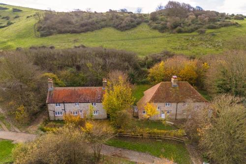 an aerial view of an old house in the hills at Skylark Cottage at Seven Sisters in West Dean