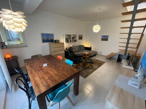 a living room with a table and a couch at 4 Guests: River & Garden Charm in Budapest