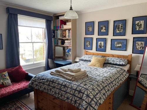 a bedroom with a bed and a window at St Elmo Felixstowe in Felixstowe