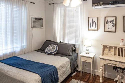 a small bedroom with a bed and a window at The Danish Nydam - A Sailors Mooring in Christiansted