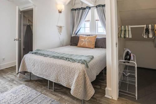 a bed in a room with a window at The Mary Read - A Pirates Serenity in Christiansted
