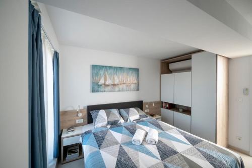 En eller flere senge i et værelse på Apartment Garden Palace A125