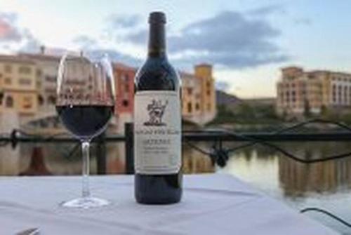 a bottle of wine and a glass on a table at Lake Las Vegas Resort Vacation in Las Vegas