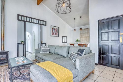 a living room with a couch and a fireplace at The Spanish House in Centurion