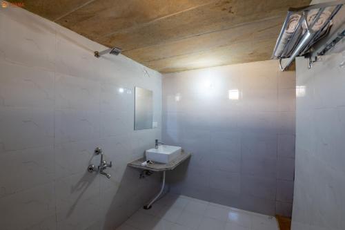 a bathroom with a sink and a mirror at Shama Desert Luxury Camp & Resort in Jaisalmer