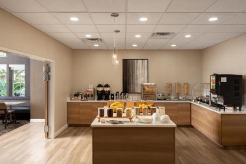 a kitchen with a counter with fruits on it at Residence Inn by Marriott Orlando East/UCF Area in Orlando