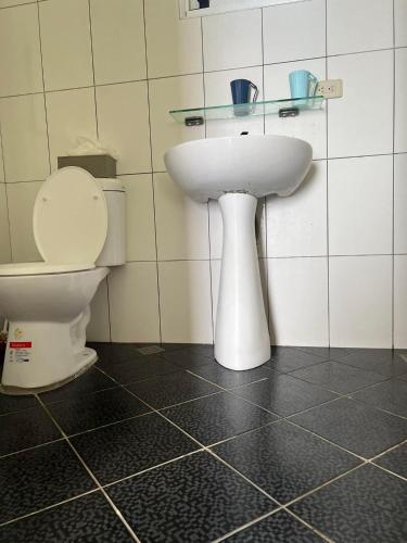 a bathroom with a sink and a toilet at Haven Seaview Homestay in Lanyu