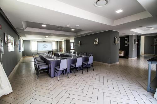 a room with a long table and chairs in it at Grand Hotel Villa Itria Congress & Spa in Viagrande