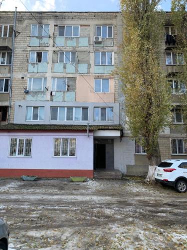 an empty parking lot in front of a building at One Room Apartment in Chişinău
