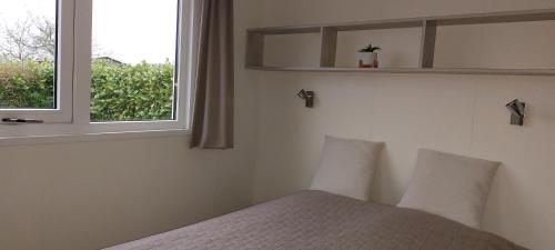 Postel nebo postele na pokoji v ubytování Tinyhouse