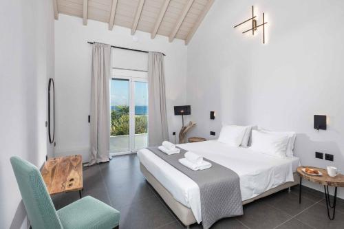 Ένα ή περισσότερα κρεβάτια σε δωμάτιο στο Villa Apanemia Mare