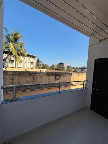 a view from the inside of a building with a balcony at White Haven Homestay in Alibag