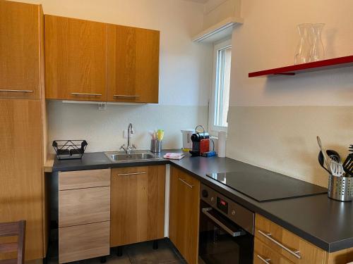 a kitchen with a sink and a counter top at Muralto-Locarno: Miramonti Apt. 8 in Muralto