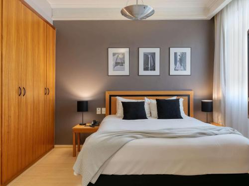 Cama ou camas em um quarto em Mercure Belo Horizonte Savassi