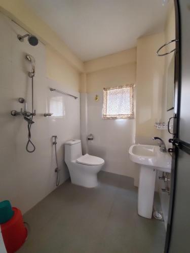 a bathroom with a toilet and a sink at santoshi guest house in Pokhara