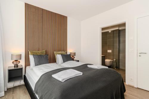Una cama o camas en una habitación de Sif Apartments by Heimaleiga