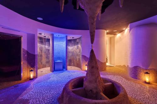 a room with a tub in the middle of a room at Barceló Hydra Beach in Thermisía