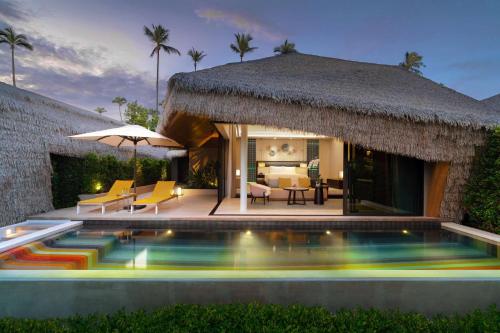 a villa with a swimming pool and a resort at Hyatt Regency Koh Samui in Chaweng