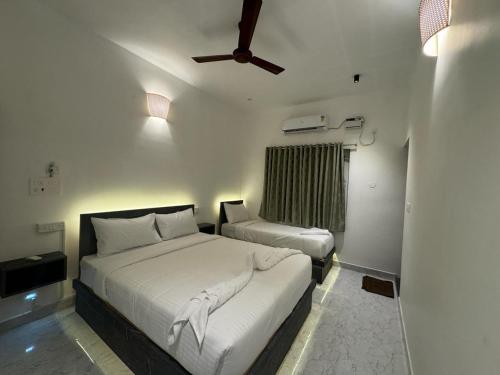 מיטה או מיטות בחדר ב-La Tamara Suite