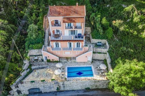 an aerial view of a house with a swimming pool at Villa Agni Sea View in Agní