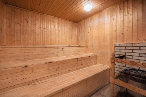 a wooden sauna with a wood paneled wall at Balneocomplex Kamena in Velingrad