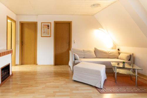 a living room with a couch and a table at Feriendorf Slawitsch in Bad Sulza