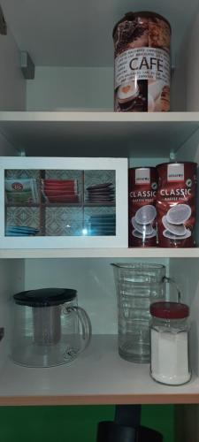 a shelf with some food items on it at Ferienwohnung in Weyregg am Attersee in Weyregg