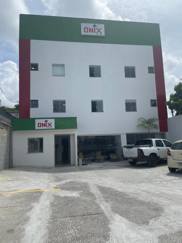 a building with a parking lot in front of it at ONIX AGUAS CLARAS in Salvador