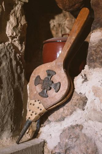 a wooden spoon with a flower painted on it at Holiday home Sweet Shelter with jacuzzi in Živogošće