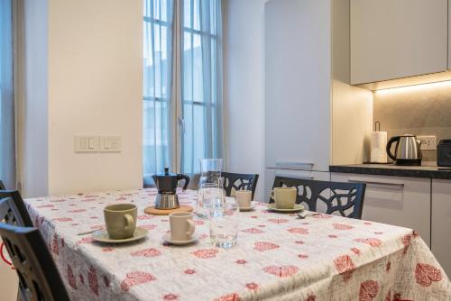 a dining room table with a table cloth on it at Moie Piane in Tione di Trento
