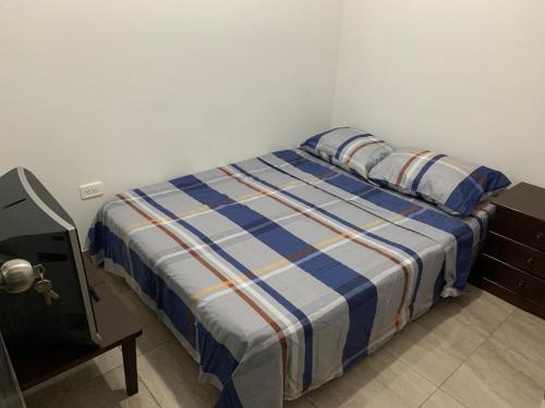 En eller flere senge i et værelse på Apartamento En Cali