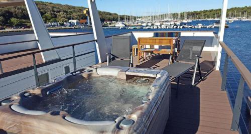 a hot tub on the deck of a cruise ship at HOUSE BOAT OLIVA - Floating House in Pula