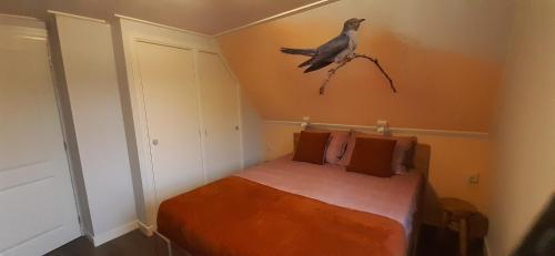 Ein Bett oder Betten in einem Zimmer der Unterkunft B&B de Zilverreiger