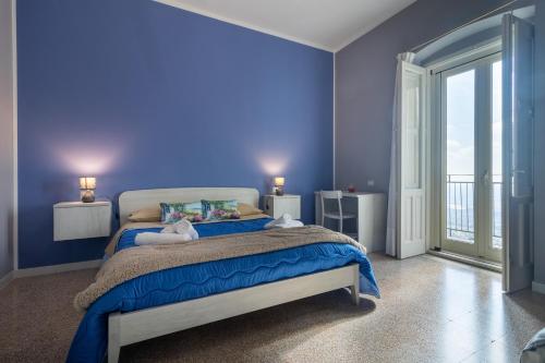 Ένα ή περισσότερα κρεβάτια σε δωμάτιο στο Dormiamoci Sù
