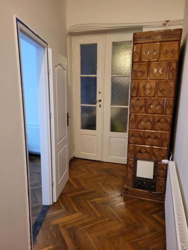 a hallway with a room with a door and a mirror at Agnieszki Room nr 2 in Krakow