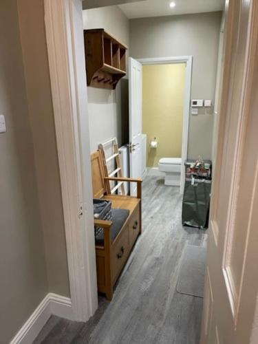 a room with a bathroom with a sink and a toilet at The Blue Cottage with luxurious Super King bed in Darlington