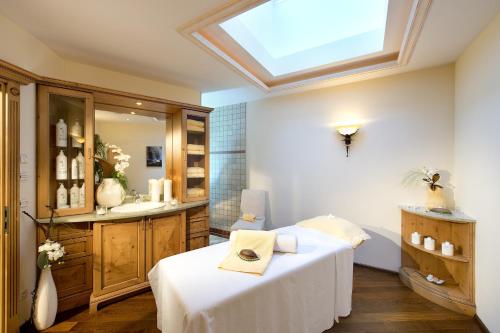 a room with a bed and a skylight at Superior Hotel Post Ischgl in Ischgl