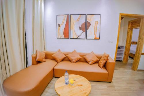 a living room with a couch and a table at Makeri Residence - Musanze , Rwanda in Ruhengeri