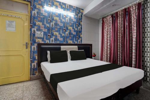 Säng eller sängar i ett rum på SPOT ON Hotel Drip Inn