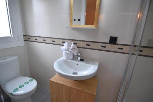 a bathroom with a sink and a toilet at RNET - MT - Casa Can Carles in Roses