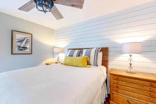 a bedroom with a bed and two lamps and a dresser at Salty Dawgs Jr in Mexico Beach