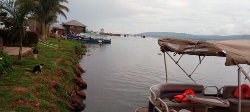 a body of water with two boats in it at GOOLO guesthouse in Jinja