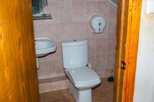 a bathroom with a toilet and a sink at George&Marry Guest House and hostels in Chişinău