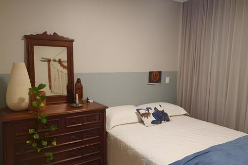 Katil atau katil-katil dalam bilik di Casa confortável com vista mar e piscina