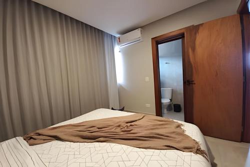 Katil atau katil-katil dalam bilik di Casa confortável com vista mar e piscina