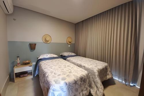 Katil atau katil-katil dalam bilik di Casa confortável com vista mar e piscina