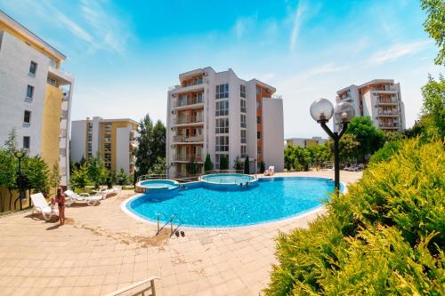 a swimming pool in the middle of a building at Imperial and Crown Fort Noks Grand Resort in Sveti Vlas