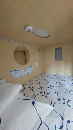 a large bed in a room with at Happy Hotel in Rīga